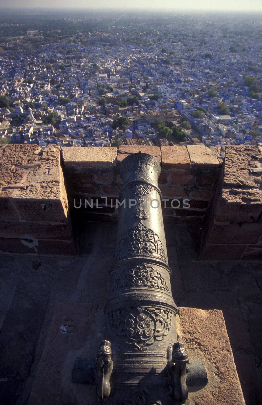 a view from the Meherangarh to the Town and Blue City of Jodhpur in the Province of Rajasthan in India.  India, Jodhpur, January, 1998