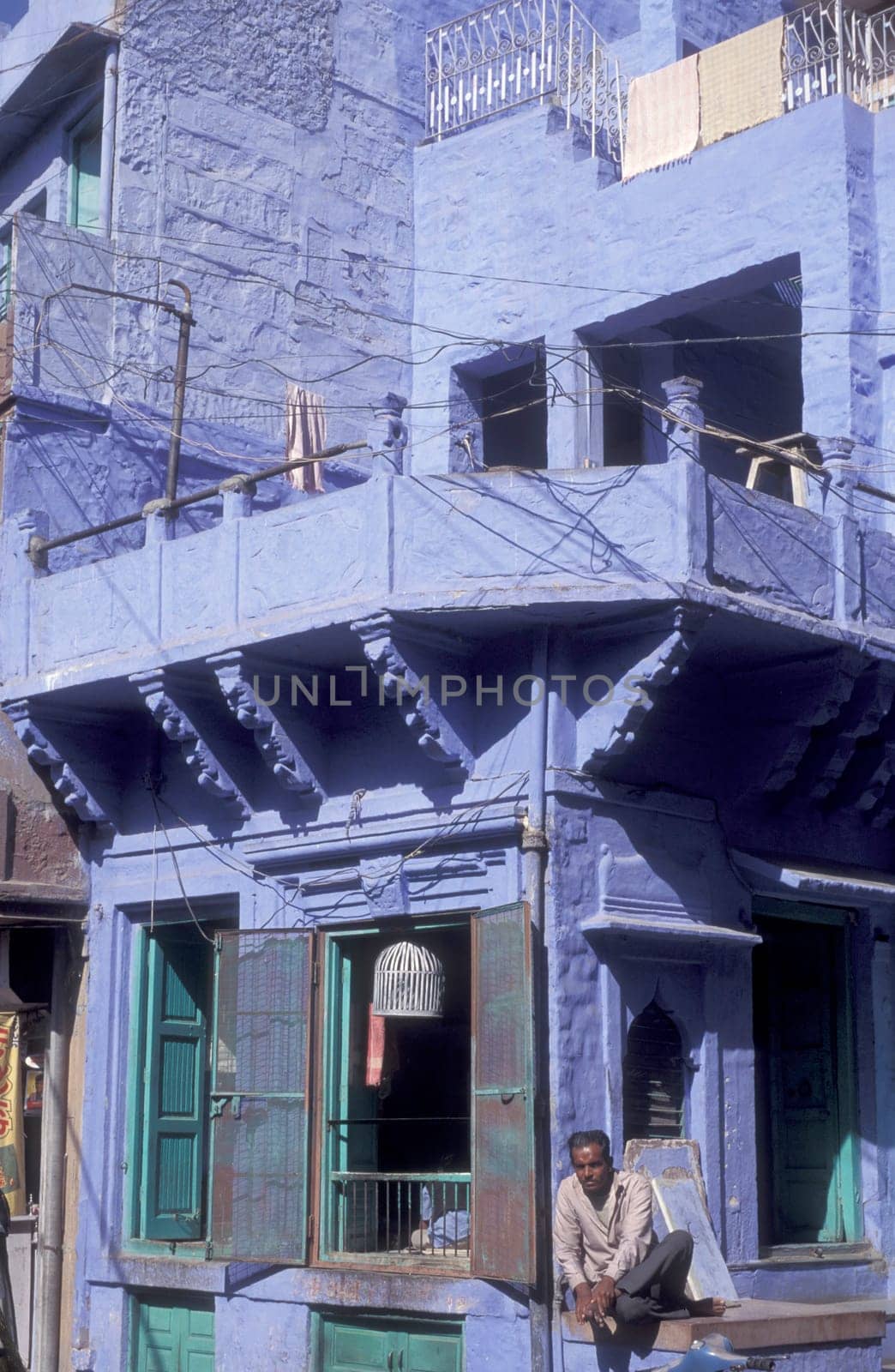 a blue painted living House in the Blue City and Town of Jodhpur in the Province of Rajasthan in India.  India, Jodhpur, January, 1998