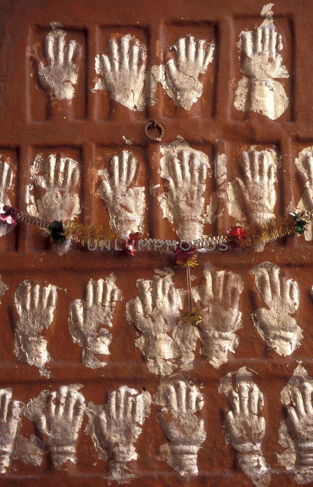 Women Queens Handprints of Sati and grid of Sculpted hands at the Meherangarh in the Town of Jodhpur in the Province of Rajasthan in India.  India, Jodhpur, January, 1998