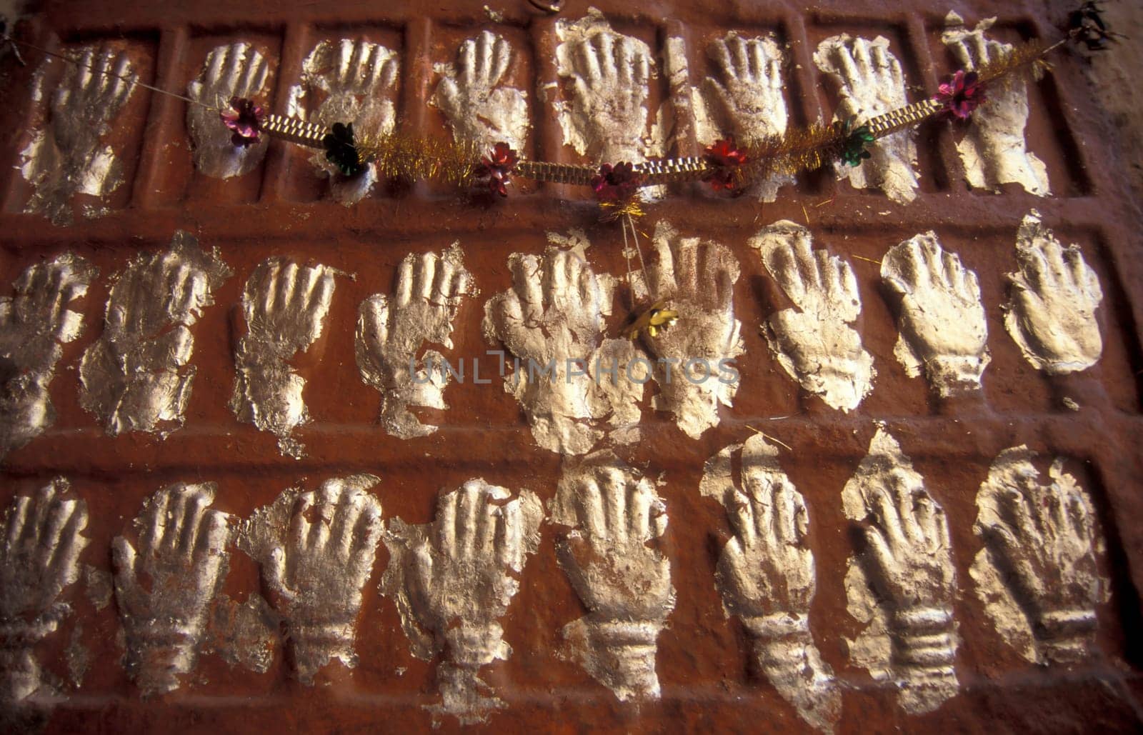 Women Queens Handprints of Sati and grid of Sculpted hands at the Meherangarh in the Town of Jodhpur in the Province of Rajasthan in India.  India, Jodhpur, January, 1998