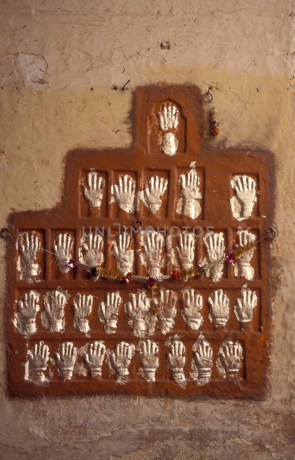 Women Queens Handprints of Sati and grid of Sculpted hands at the Meherangarh in the Town of Jodhpur in the Province of Rajasthan in India.  India, Jodhpur, January, 1998