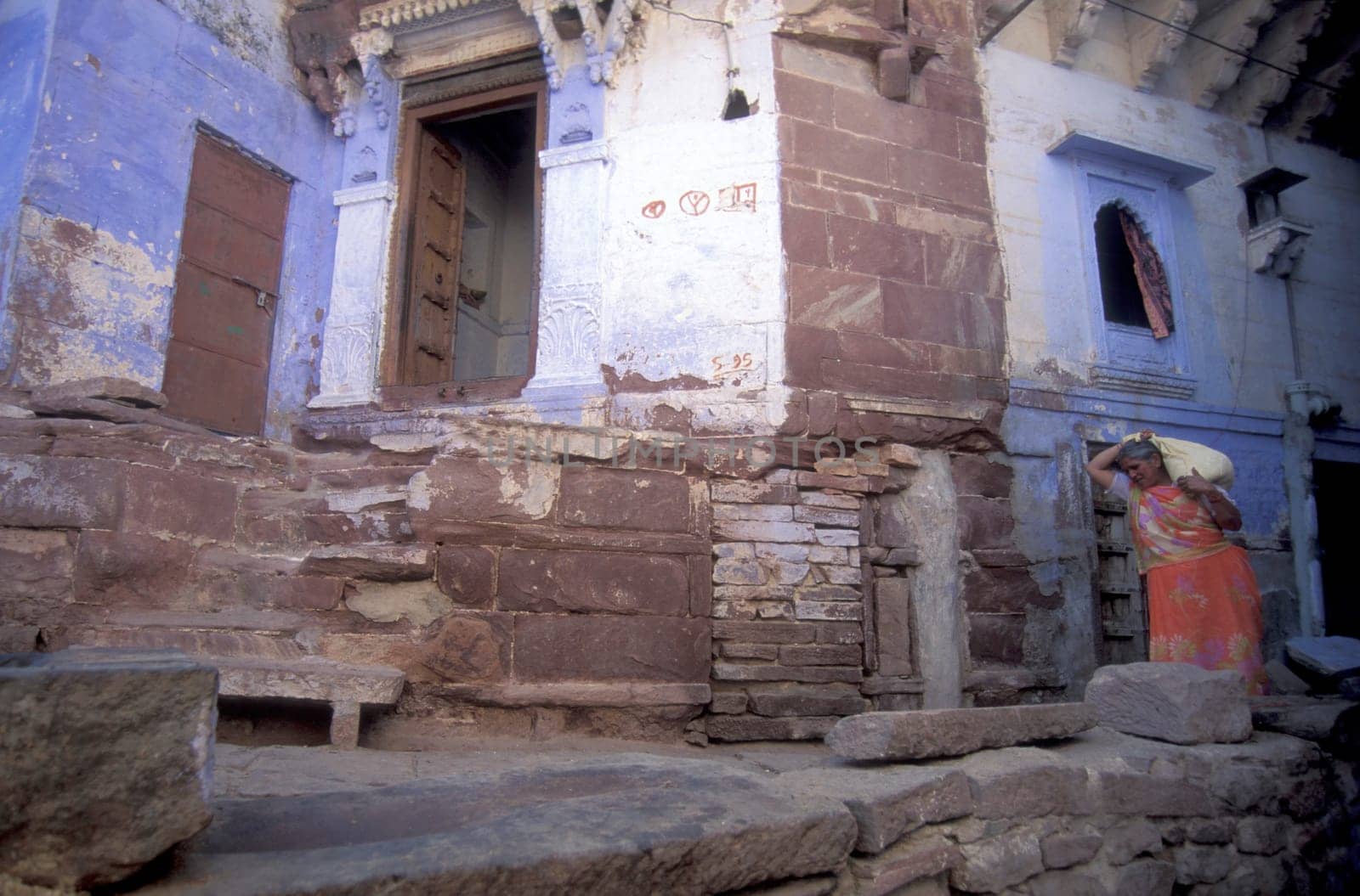 a blue painted living House in the Blue City and Town of Jodhpur in the Province of Rajasthan in India.  India, Jodhpur, January, 1998