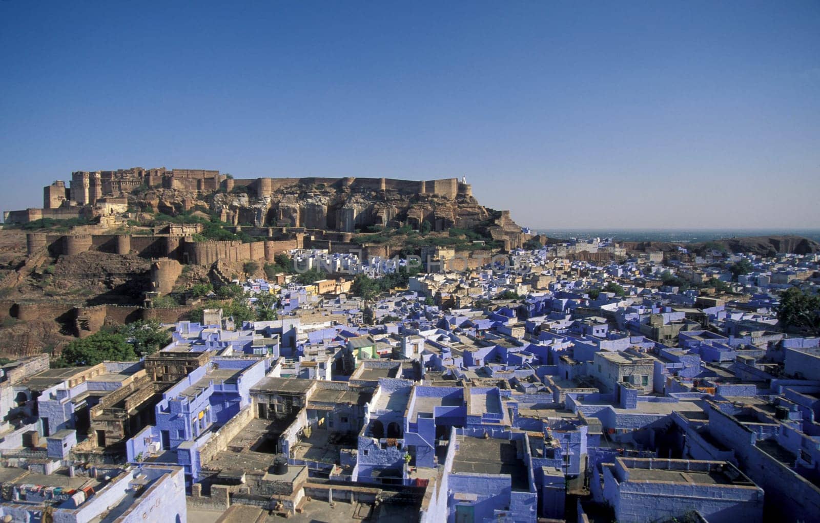 a view of the Meherangarh in the Town and Blue City of Jodhpur in the Province of Rajasthan in India.  India, Jodhpur, January, 1998