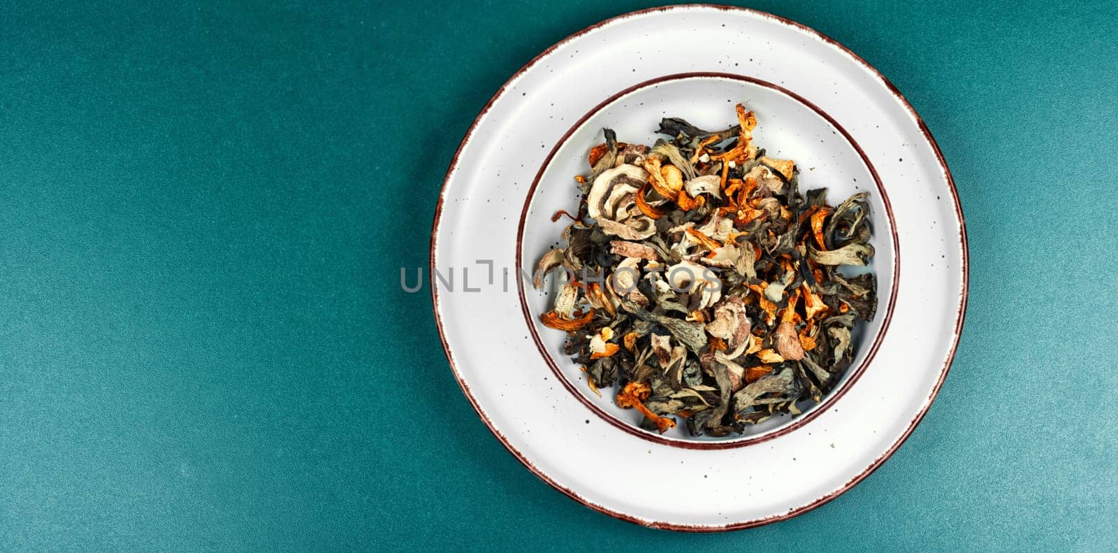 Colorful wild forest dried mushrooms, dried mushroom slices. Top view. Copy space.