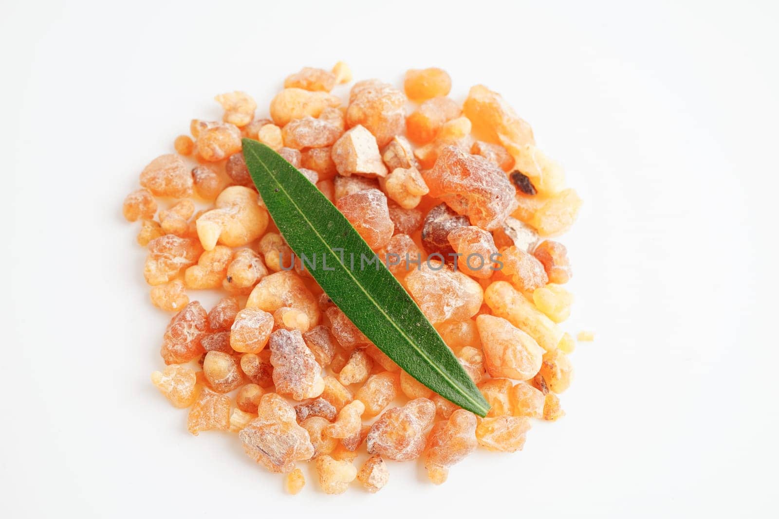 Frankincense or olibanum aromatic resin isolated on white background used in incense and perfumes.