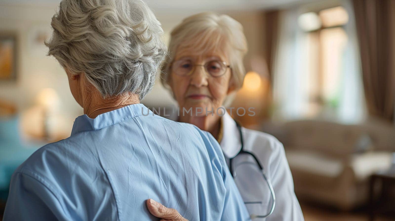 An elderly woman in a medical setting gently comforts another elderly woman, who appears reflective, emphasizing empathy and care.