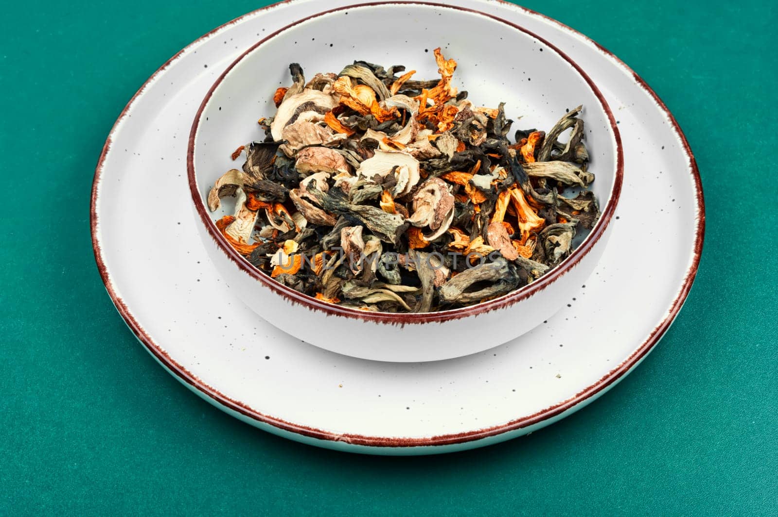 A vibrant array of dried mushrooms on a rustic wooden table