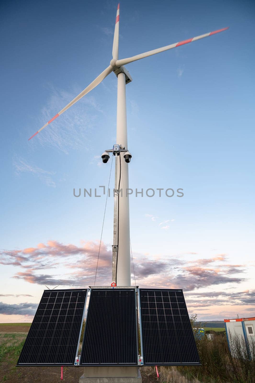 Windmill with solar panel, transformation to renewable sustainable energy, electricity generator, environmental conversation