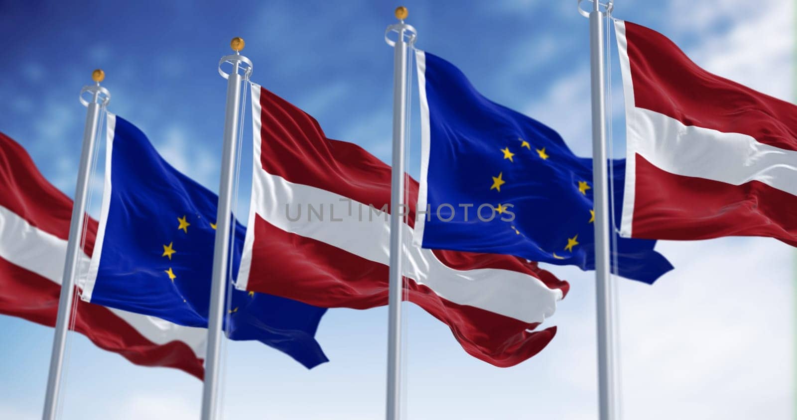 Flags of Latvia and the European Union waving on a clear day. Latvia is a member of the European Union and the Eurozone. 3d illustration render. Fluttering fabric