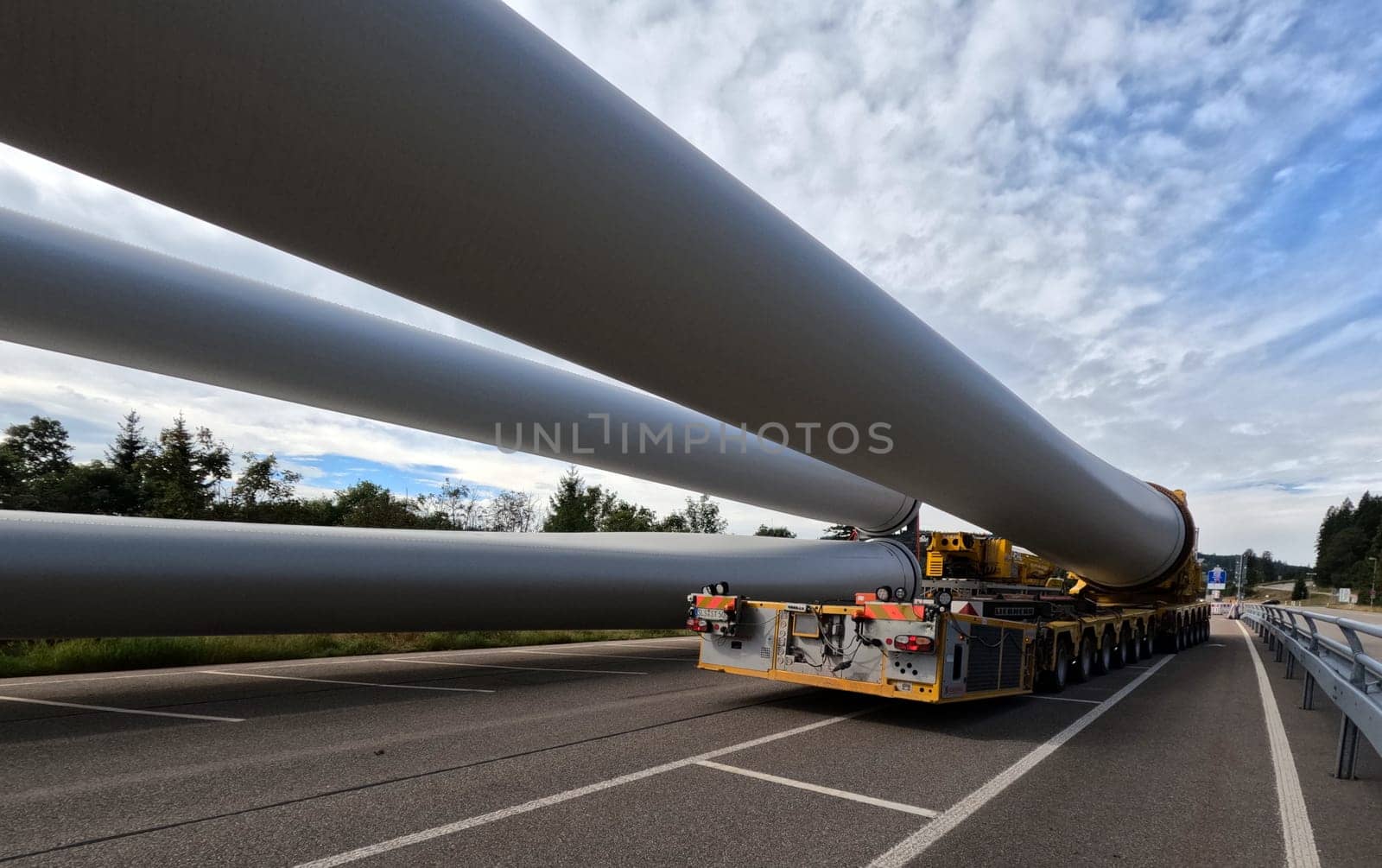 The 68-metre-long rotor blade is fixed to the 138-tonne self-propelled vehicle  The heavy transport of the 68-metre-long rotor blades leads over the Feldberg (Breisgau-Hochschwarzwald district) to Freiburg's local mountain,the Schauinsland  The rotor blades are mounted on a self-propelled vehicle,and they reach their destination at walking pace over several days  Topic picture wind energy