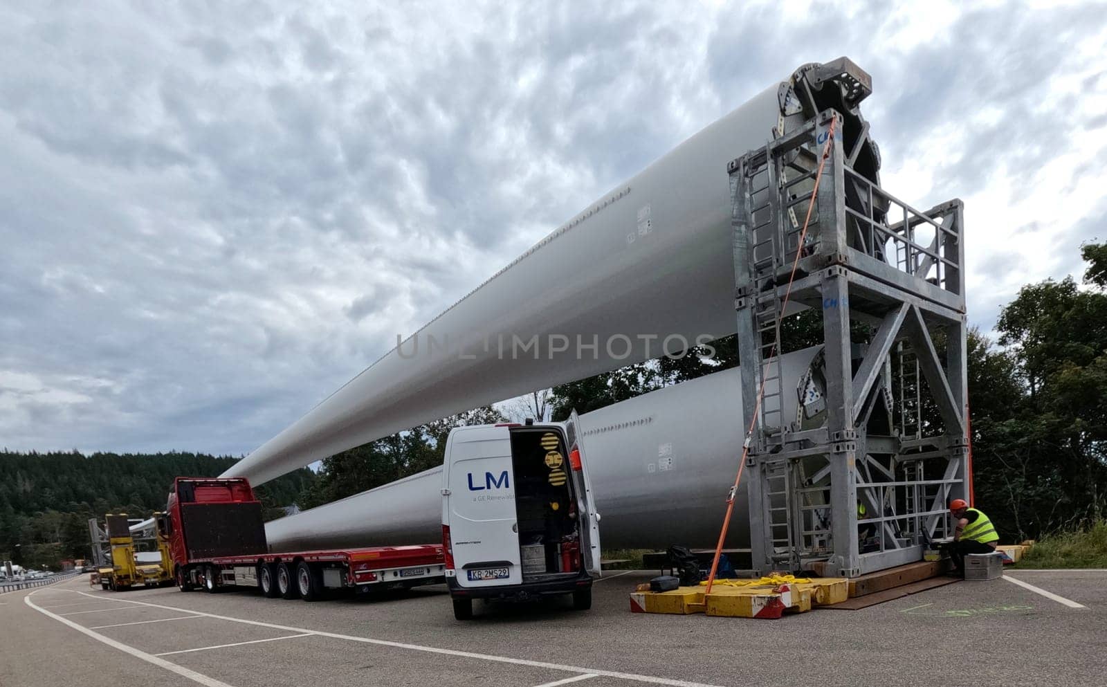 Further rotor blades for the wind farm at Schauinsland are ready for installation in the parking lot at the Feldberg Pass  The heavy transport of the 68-metre-long rotor blades leads over the Feldberg (Breisgau-Hochschwarzwald district) to Freiburg's local mountain,the Schauinsland  The rotor blades are mounted on a self-propelled vehicle,and they reach their destination at walking pace over several days  Topic picture wind energy