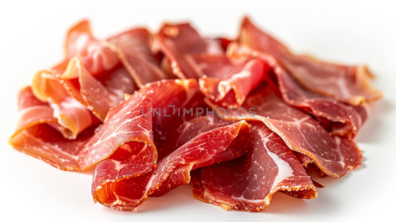 Pile of thinly sliced meat on a white surface .