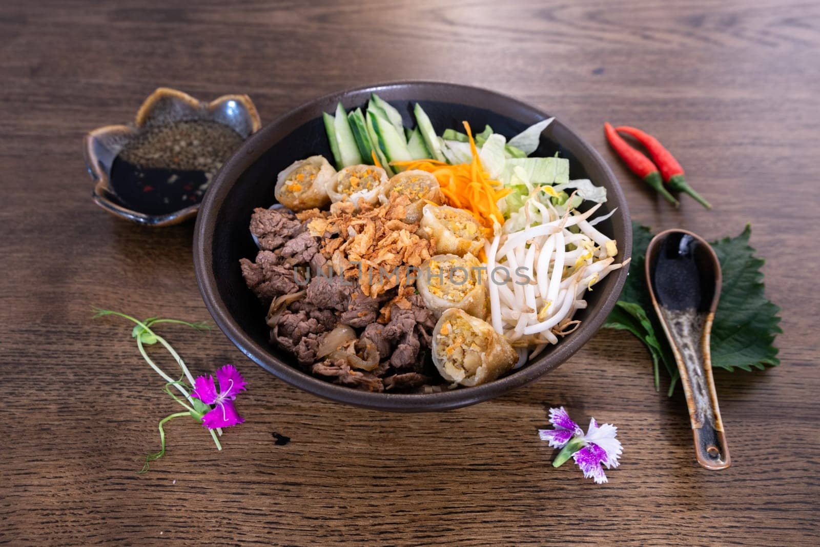 Famous bobun bowl cooked for lunch. Asiatic food ready to be eat