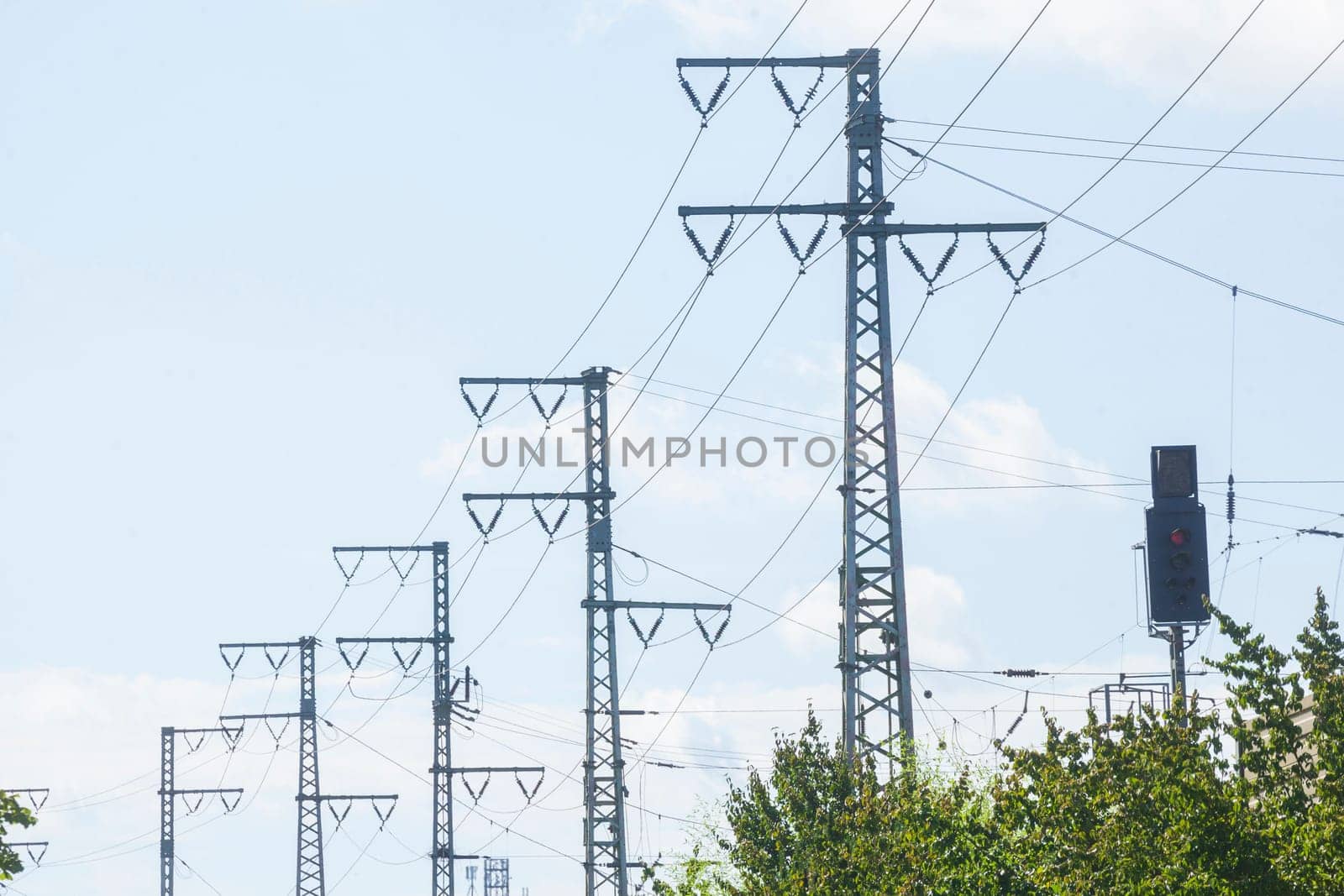 Power line, power poles, railroad system, blue sky, Germany