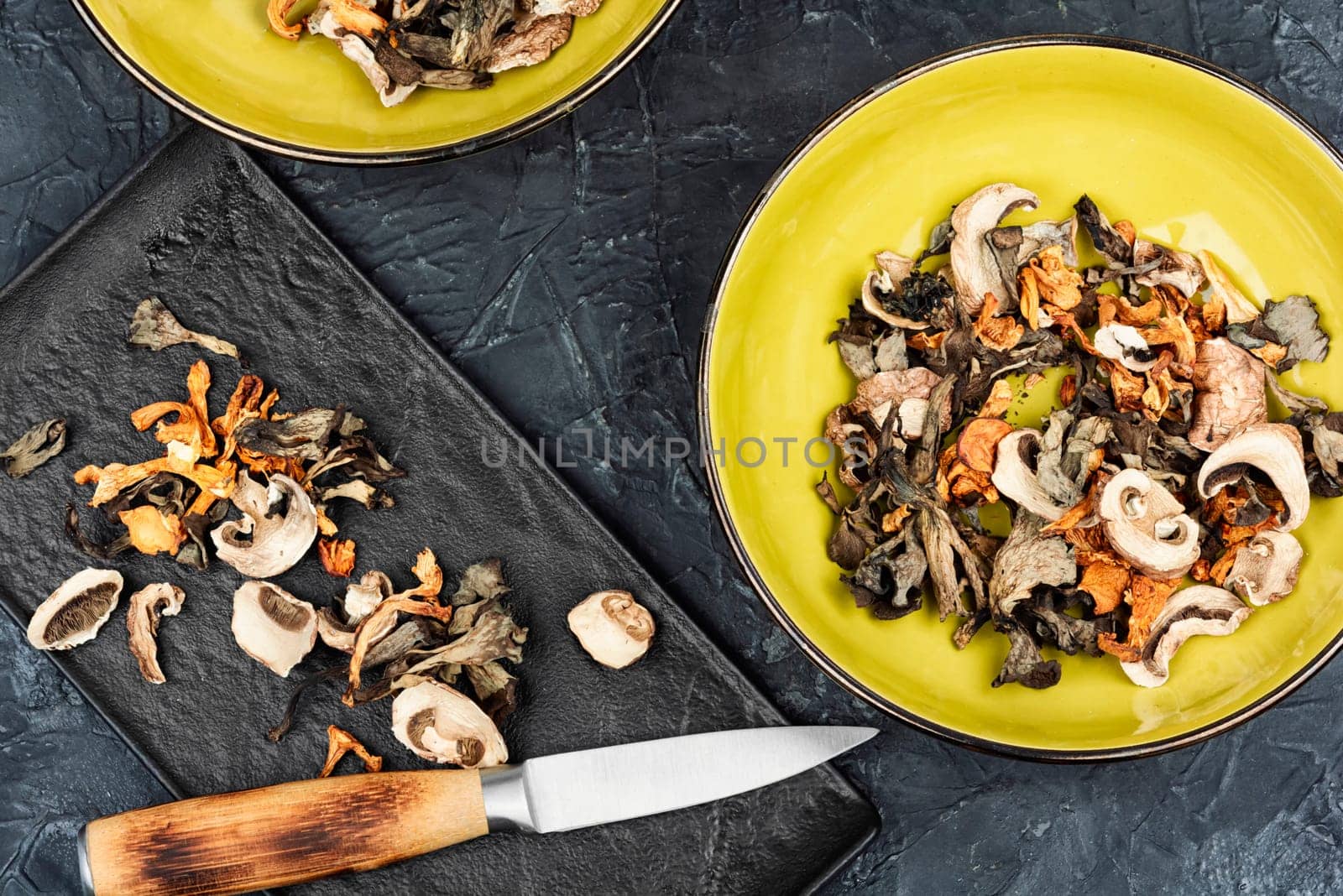 A variety of dried mushrooms. Preparation of dried mushrooms. Dry dehydrated sliced mushrooms.
