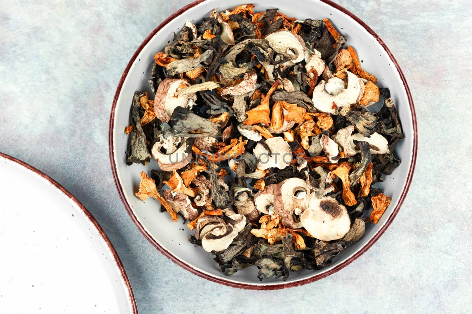 A variety of dried mushrooms. Preparation of dried mushrooms. Dry dehydrated sliced mushrooms.