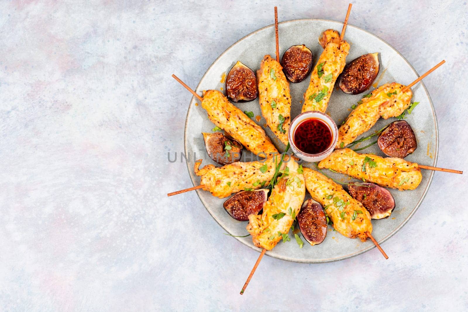Shish kebab with chicken fillet and sweet figs. Grilled meat skewers. BBQ, chicken skewers.