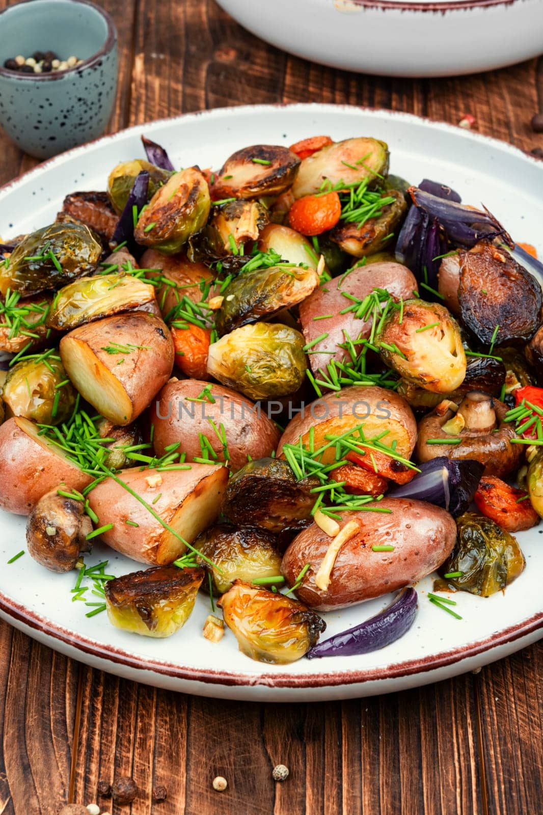 Roasted brussels sprouts and potatoes, food photography. Veggie dish, healthy eating, vegetable still life.