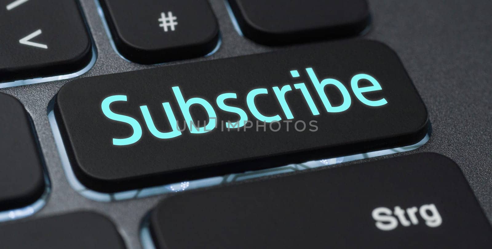 Illuminated keyboard with a labeled key - Subscribe