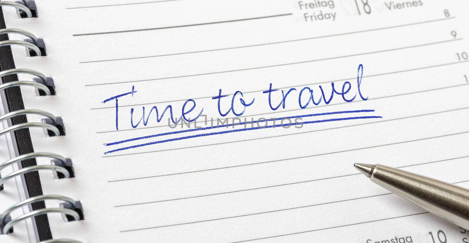 Time to travel written on a calendar page