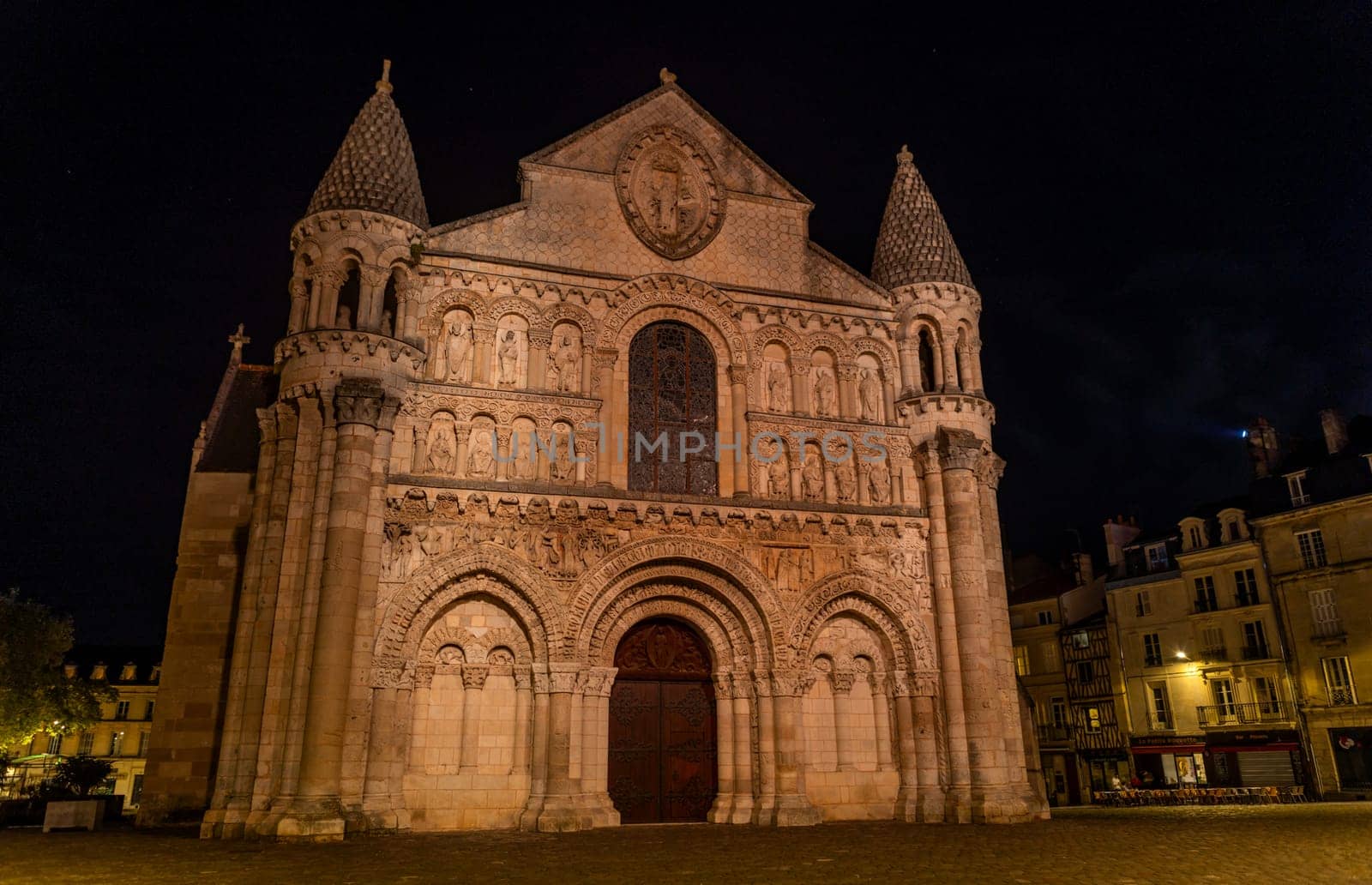 Poitiers, France: August 15, 2024: The Church of Notre Dame la Grande by night in the city of Poitiers, France