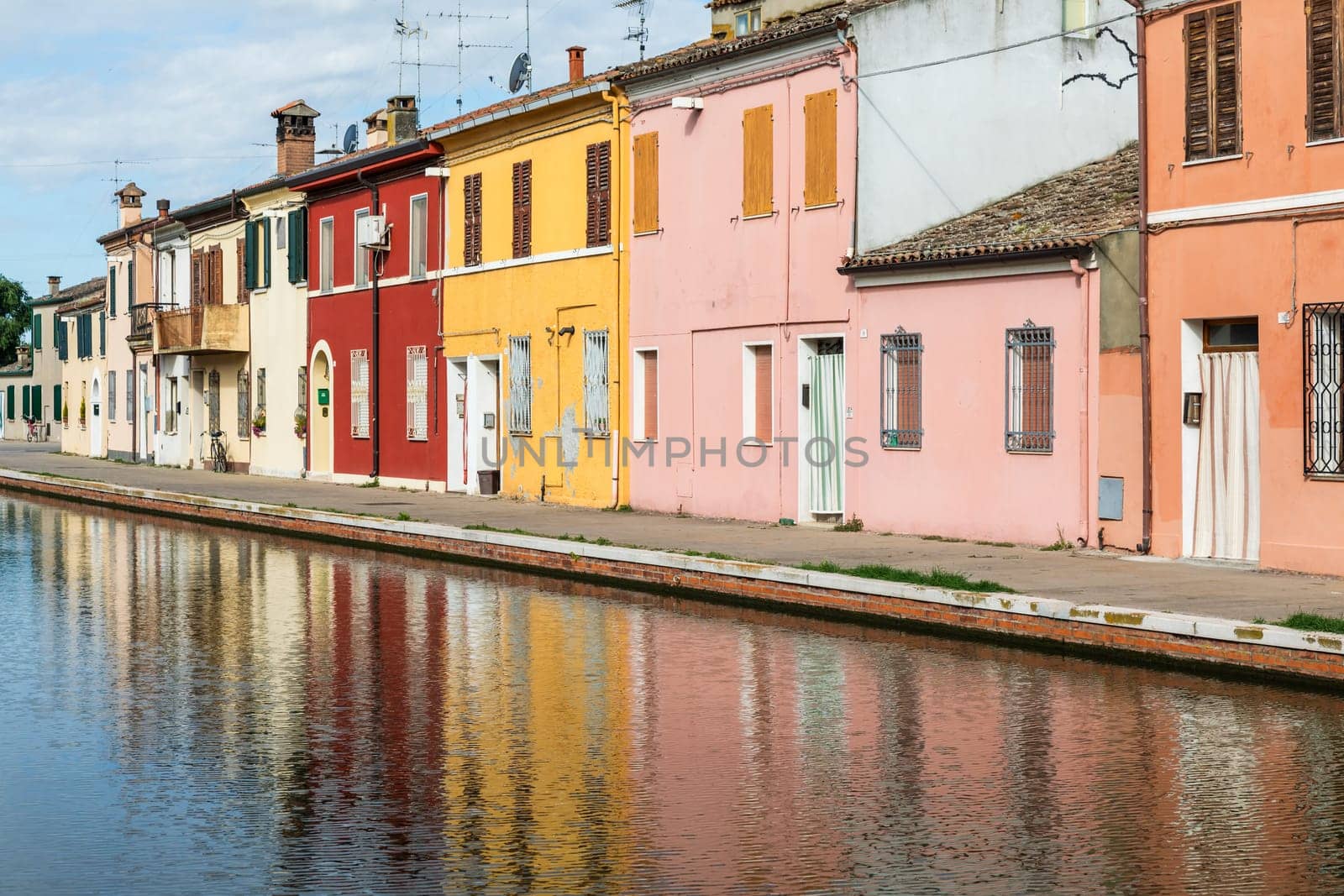 Comacchio, Italy - 11 July 2024: traditional colored buildings in Comacchio village, named the Little Venice