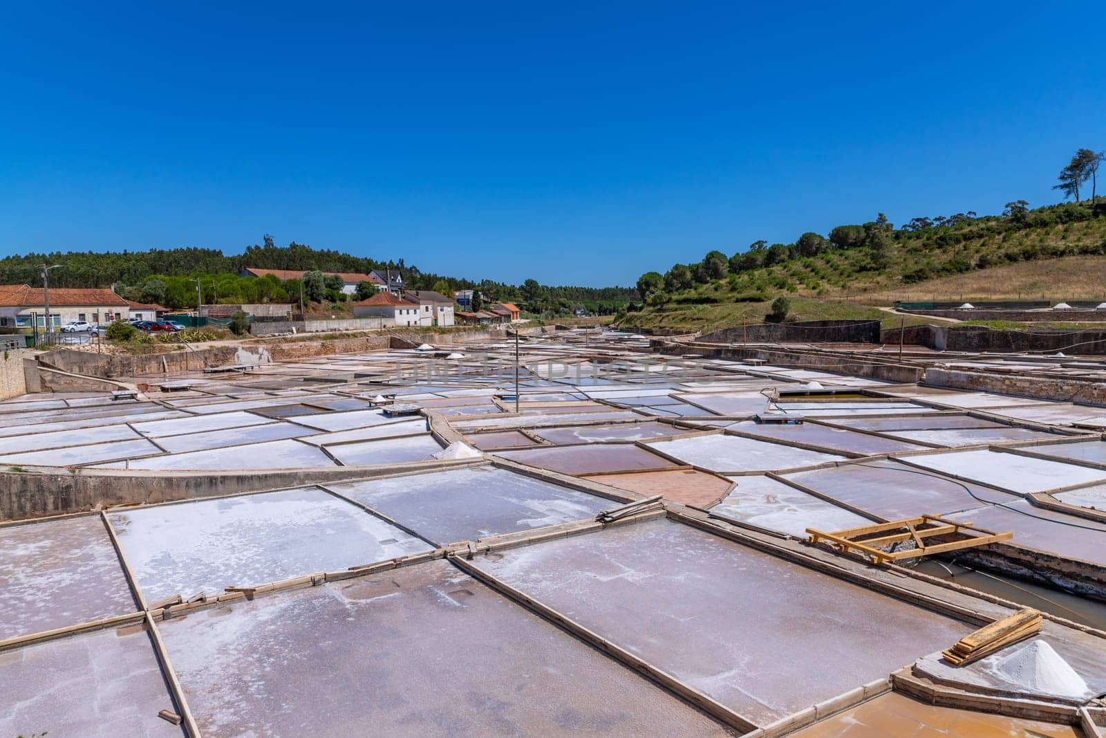 Rio Maior, Portugal: July 7, 2024: Fonte da Bica Salt Flats, aka Salinas de Rio Maior, system of shallow water compartments and gutters for salt extraction, Portugal