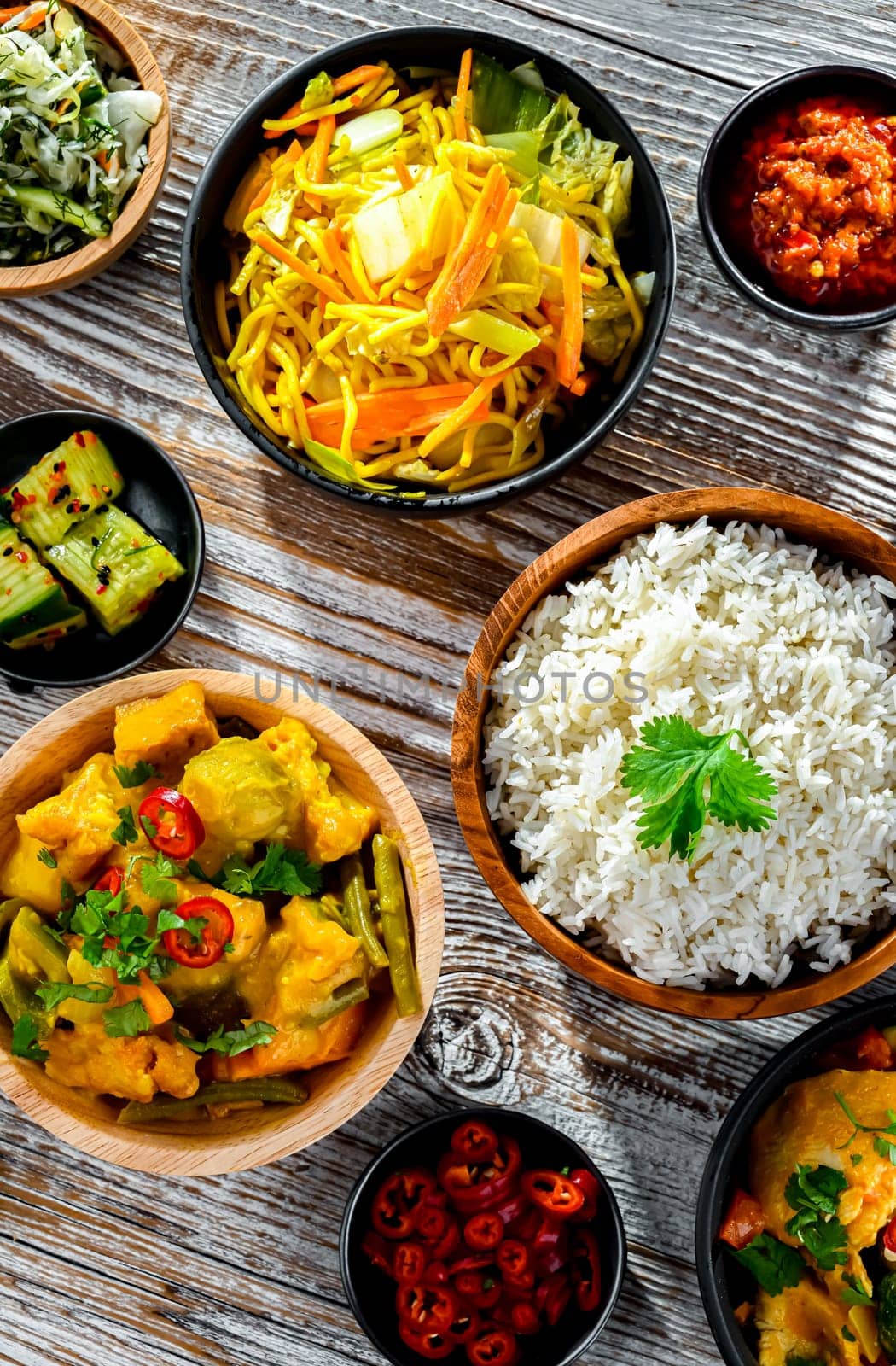 Composition with variety of east asian dishes.