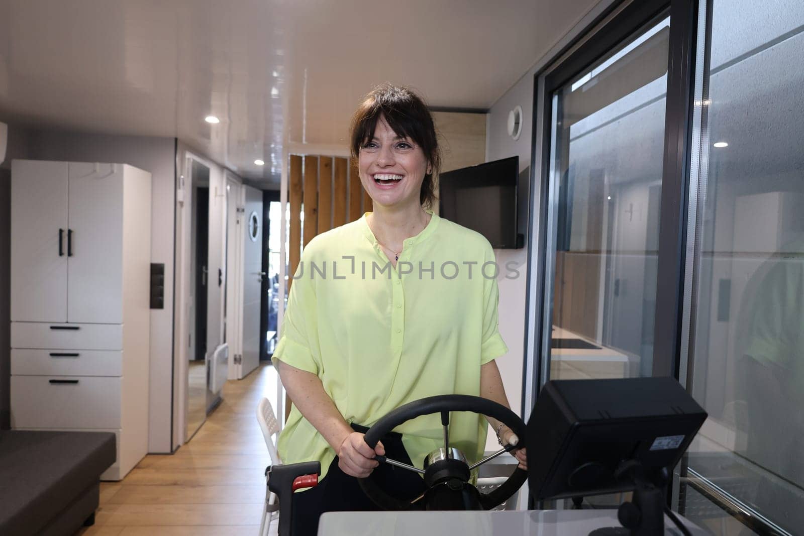 Ahoy: Model Cora is visibly having fun at the trade fair novelty,the brand new houseboat   The Interboot 2024 Friedrichshafen trade fair will open its doors on 25.09.2024
