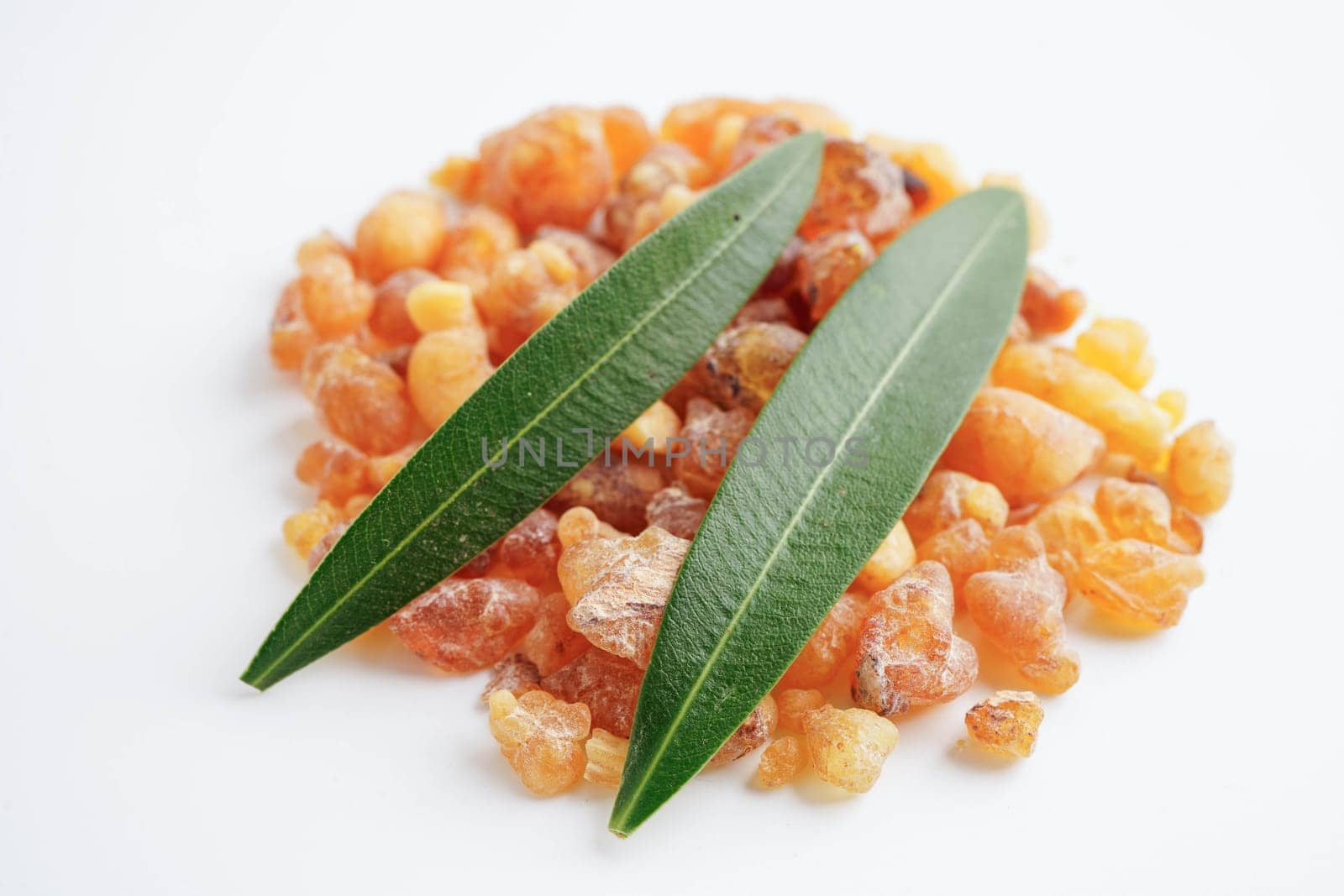 Frankincense or olibanum aromatic resin isolated on white background used in incense and perfumes.