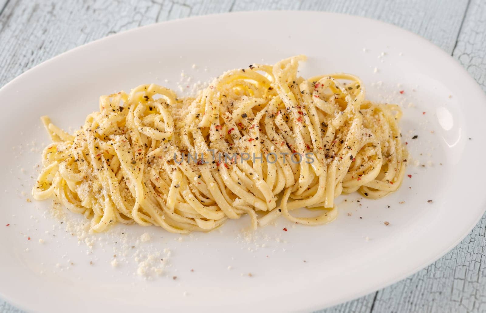 Portion of Cacio E Pepe - pasta with cheese and pepper