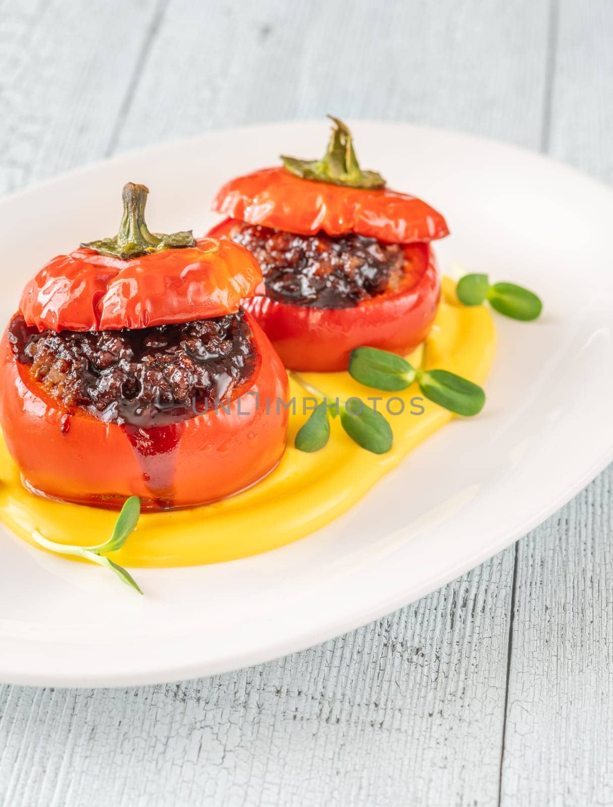 Red bell peppers stuffed with ground beef