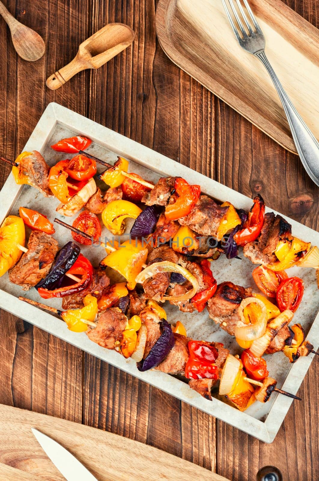 Grilled kebabs with vegetables on skewers. BBQ skewers. Top view.