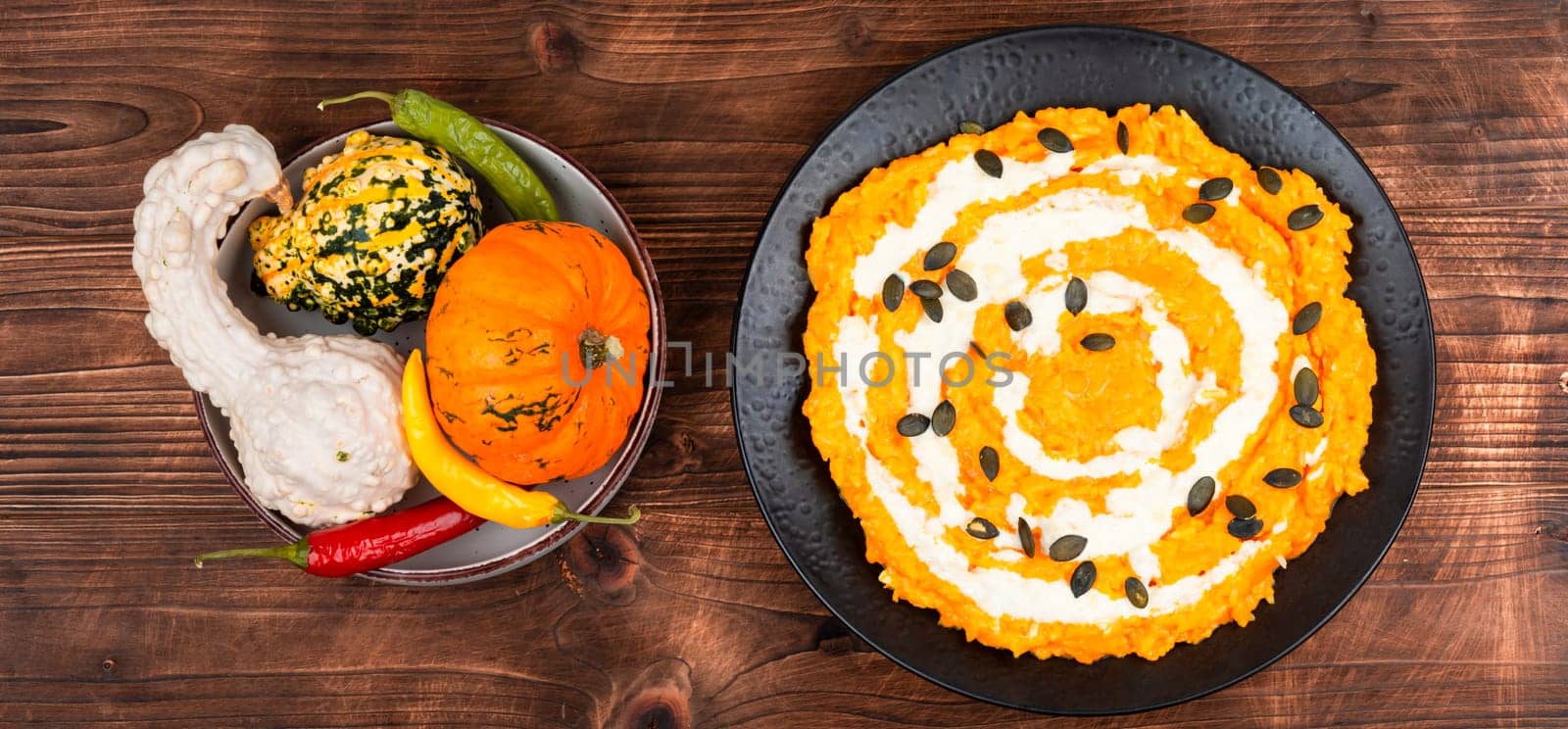 Risotto with pumpkin and parmesan cheese. Vegetarian vegan food. Close up.