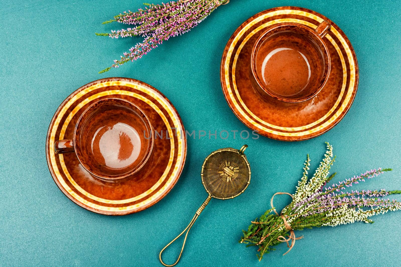 Herbal tea with fresh heather, homeopathy. Heather blossom tea on wooden table.