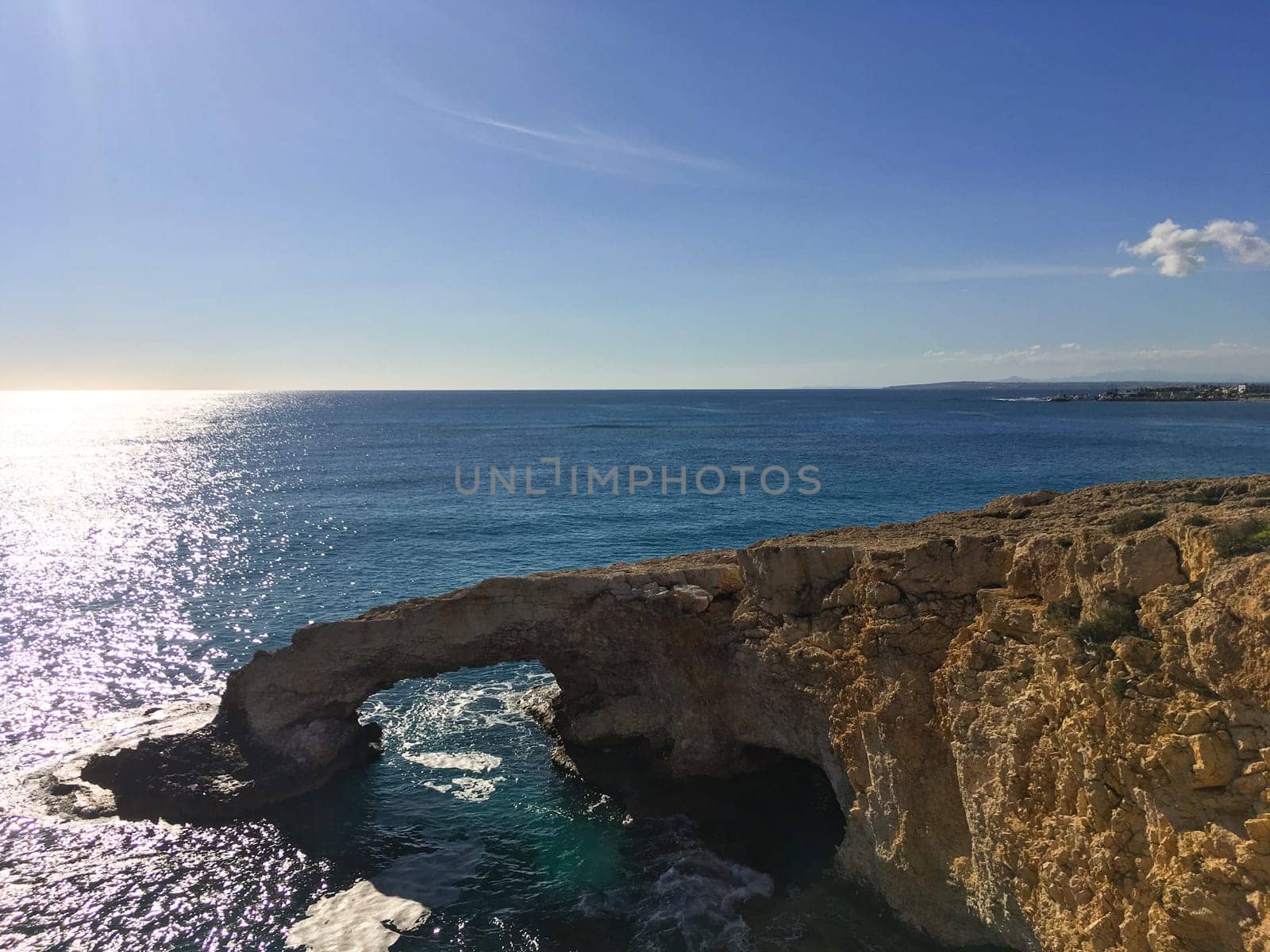 Love bridge near Ayia Napa in Cyprus. Natural rock arch Bridge of Lovers at Cape Greco. Sea caves on coastline between Agia Napa and Cavo Greco National park.