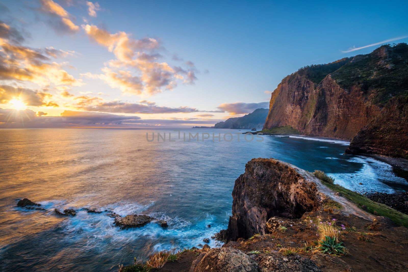 View of Madeira scenic cliffs coastline landscape on sunrise, Guindaste viewpoint, Madeira island, Portugal