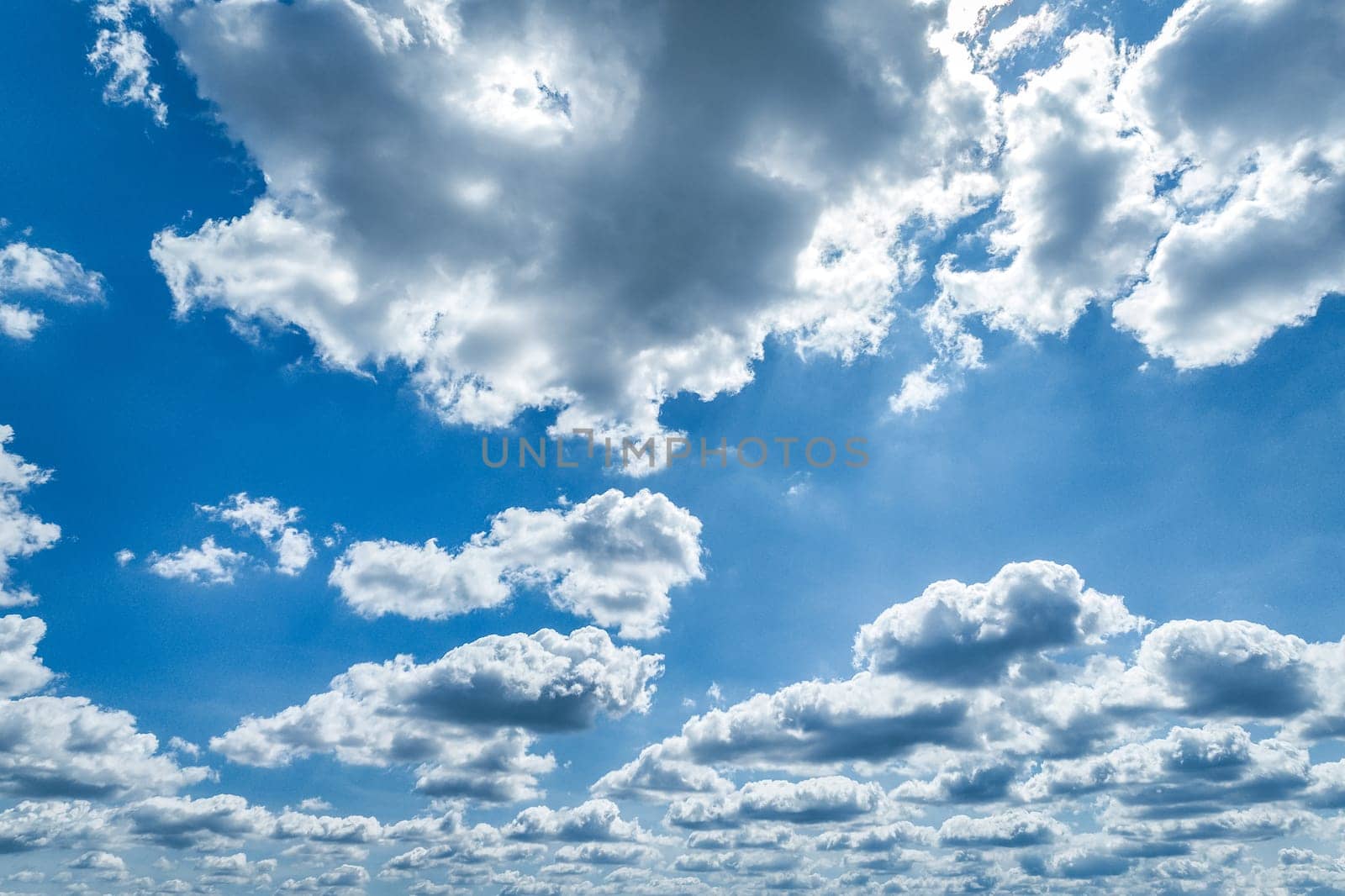 Beautiful blue sky and white cumulus clouds abstract background. Cloudscape background. Blue sky and fluffy white clouds on sunny days. Blue sky and daylight. World Ozone Day. Ozone layer. Summer sky.