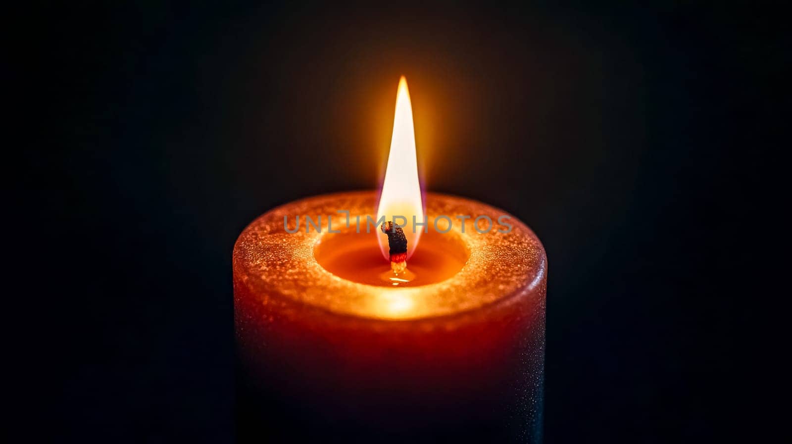 Single candle burns brightly in the darkness, casting a warm glow and flickering in red, orange, and yellow hues, evoking feelings of hope and tranquility for meditation