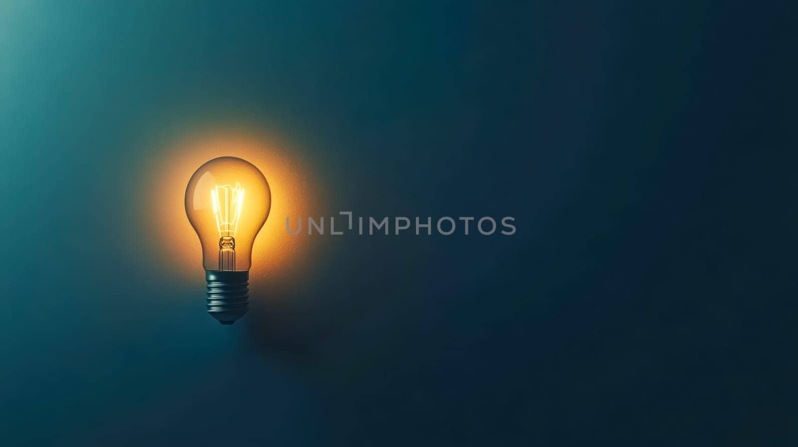 Vintage light bulb softly glows on a blue background, evoking creativity and innovation