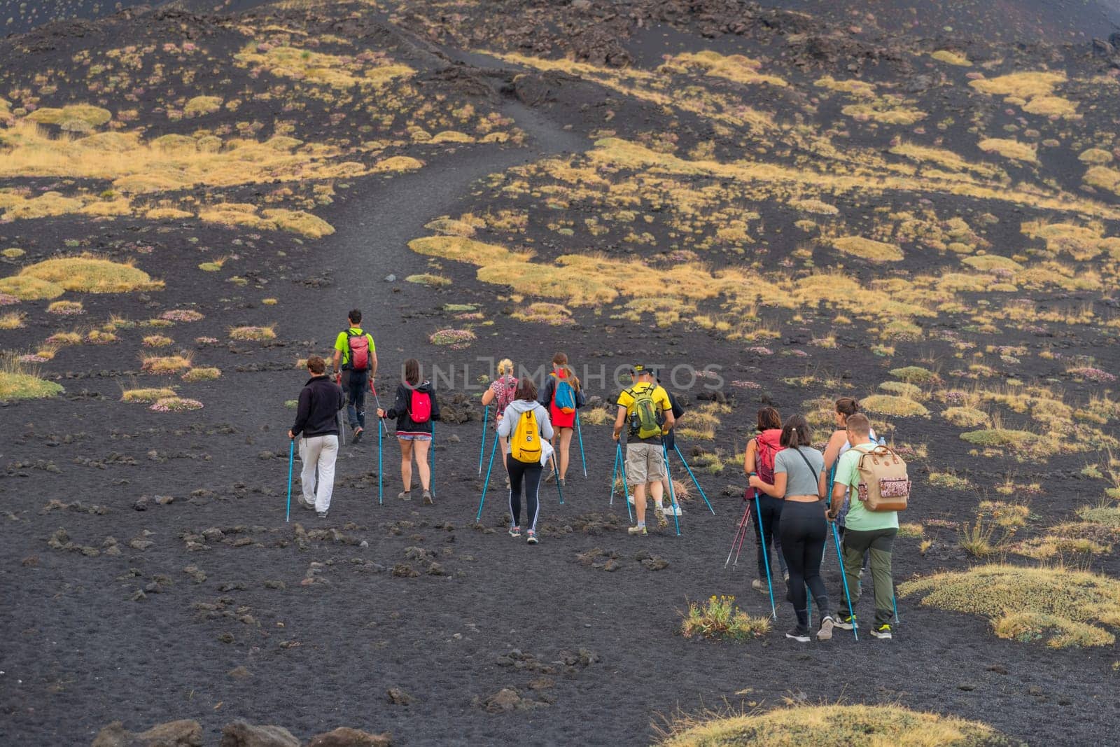 Mount Etna, Catania, Sicily, Italy - August 13, 2024: People walking on crater of active volcano in Mount Etna, Sicily, Italy