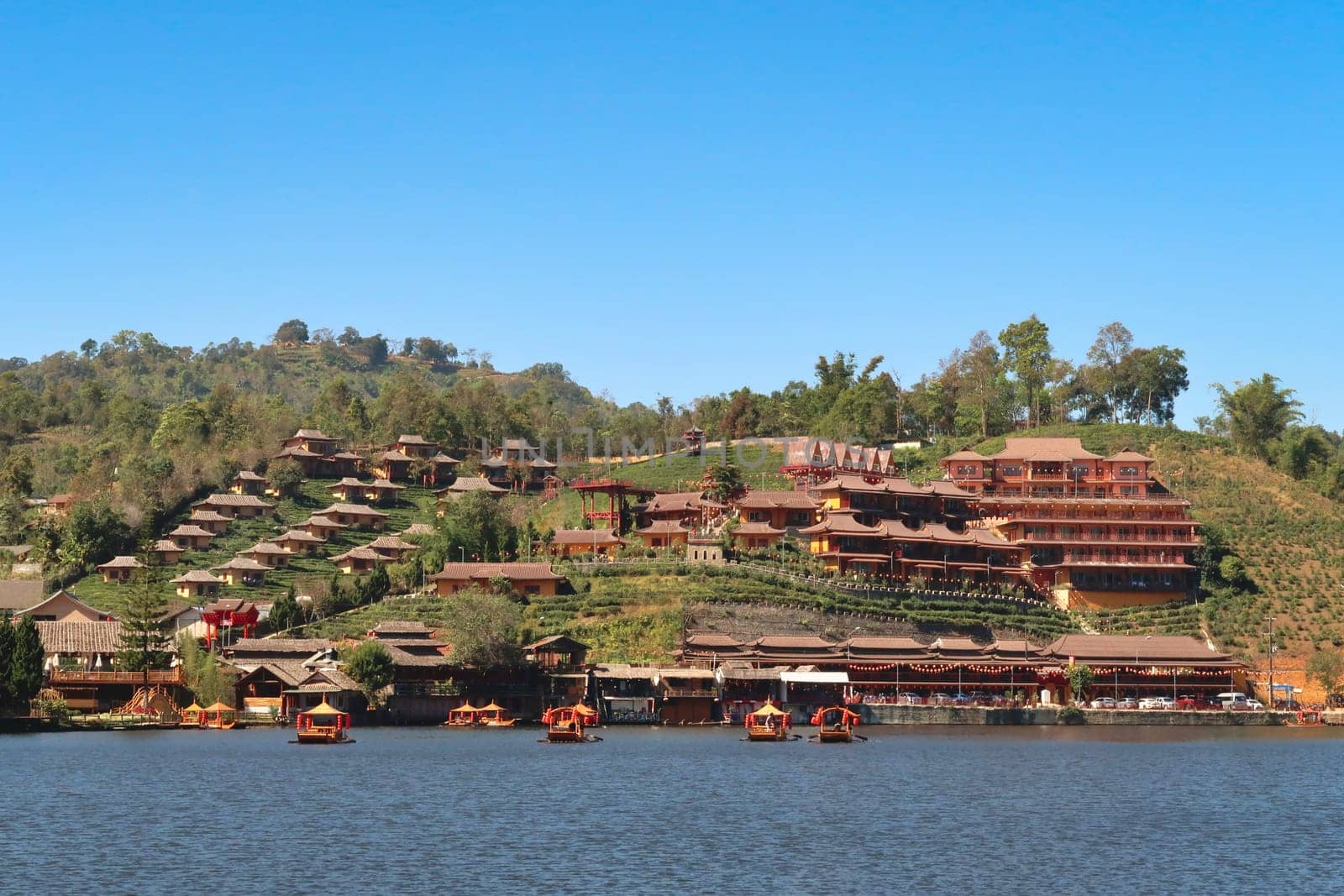 View from the lake onto the Ban Rak Thai, Mae Aw Village, a chinese village in northern Thailand, close to the border to Myanmar, Mae Hong Son Loop, Thailand 2023