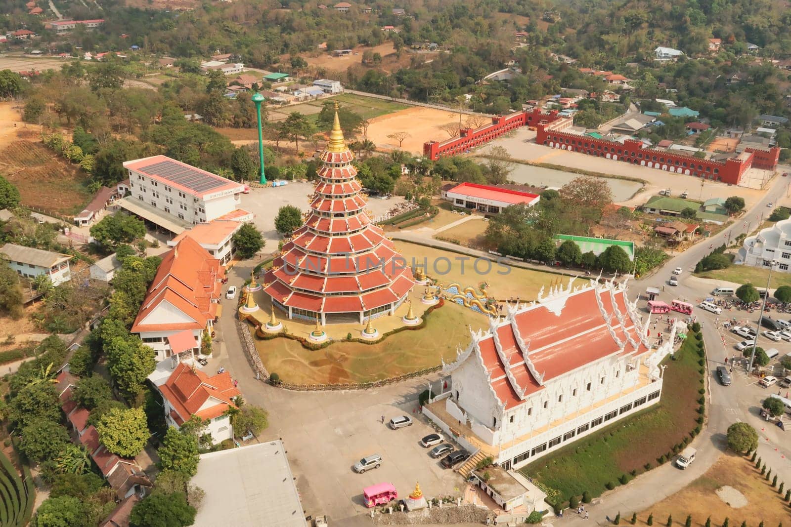 View from the highest floor, top floor inside the head of the Guan Yin Statue onto the Phop Chok Dhamma Chedi and the Wat Huay Pla Kang Temple, Chiang Rai, Thailand 2023
