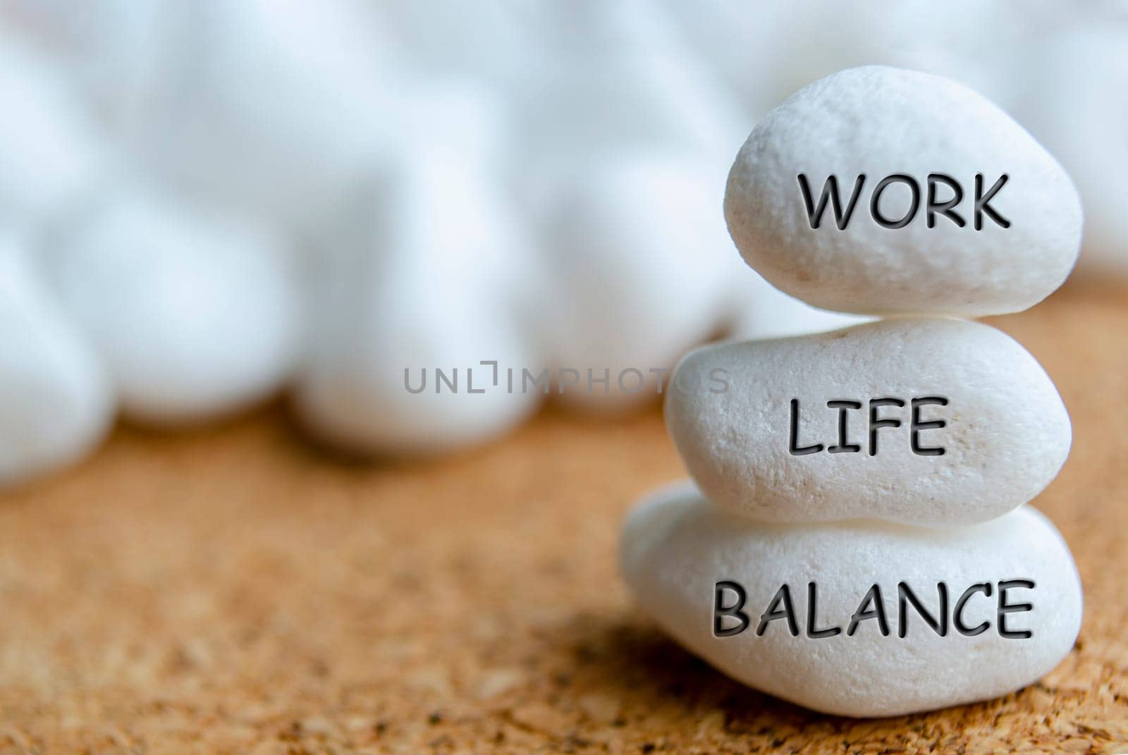 Work life balance text engraved on white stones. Life balance concept.