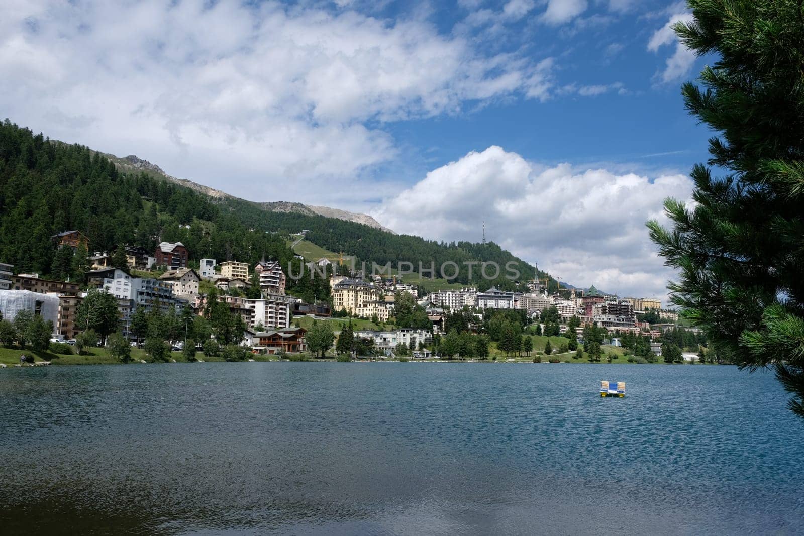 Scenic view on mountain lake of St Moritz in summer the alpine resort in the background in the upper Engadine canton of Grisons Switzerland