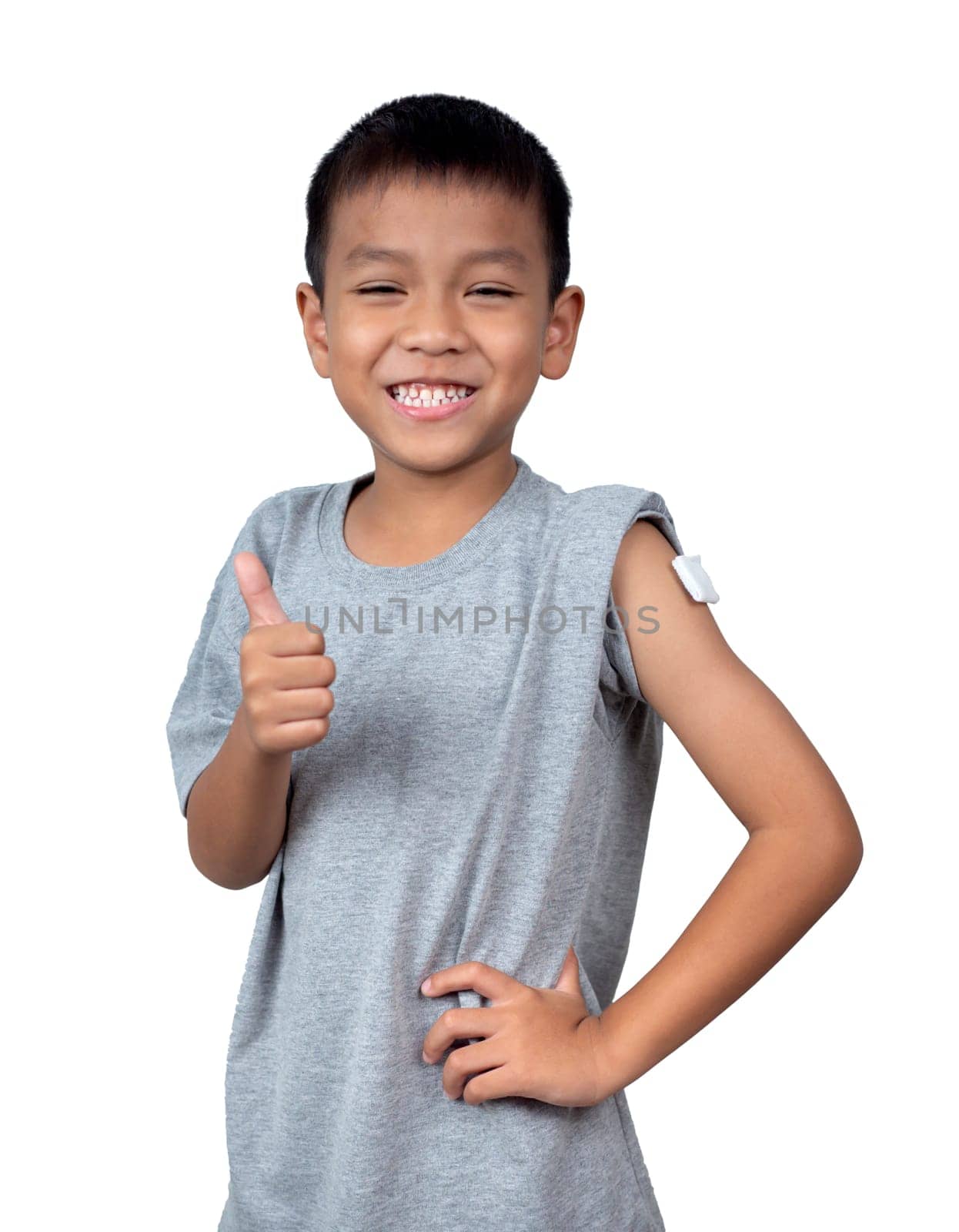 Little asian child boy wearing short-sleeve shirt with bandage plaster on her arm after vaccination for boost immunity. Injection covid vaccine, Tetanus vaccine, Flu vaccine, healthcare for children.