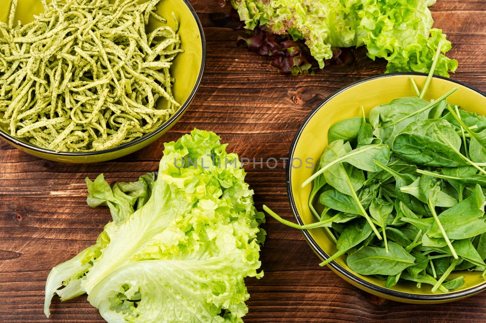 Italian cuisine vegan food Conchiglie pasta topped with spinach. Copy space.