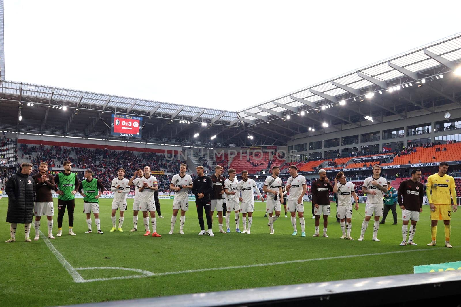 The players of newly promoted FC St. Pauli are celebrated by their own fans after the 0:3 victory in Freiburg after the match of the 1st FBL: 24-25: 1. FBL: 24-25: 5. Sptg. SC Freiburg - FC St. Pauli  DFL REGULATIONS PROHIBIT ANY USE OF PHOTOGRAPHS AS IMAGE SEQUENCES AND/OR QUASI-VIDEONann  Photo: Joachim Hahne/johapress