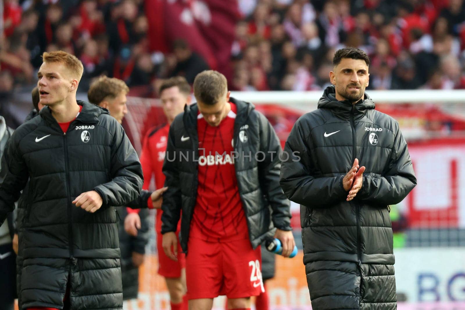 Disappointed Freiburg players,Philipp Lienhart (SC Freiburg),Matthias Ginter (SC Freiburg) and Vincenzo Grifo (SC Freiburg) thank the fans for their support,thoughtful,pondering,grumbling,dissatisfied,disappointed,disappointed,depressed,frustrated,Vincenzo Grifo (SC Freiburg),Matthias Ginter (SC Freiburg),Philipp Lienhart (SC Freiburg),  at the match of the 1st FBL: 24-25: 1st FBL: 24-25: 5th Sptg. SC Freiburg - FC St. Pauli  DFL REGULATIONS PROHIBIT ANY USE OF PHOTOGRAPHS AS IMAGE SEQUENCES AND/OR QUASI-VIDEONann  Photo: Joachim Hahne/johapress