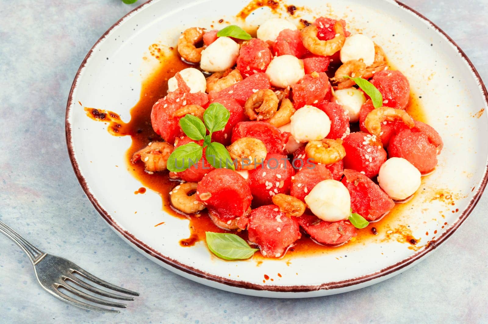 Summer salad with watermelon, mozzarella cheese and shrimp.
